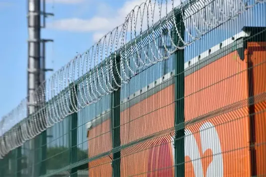 Flat razor wire keeps out illegals